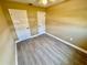 Cozy bedroom featuring a ceiling fan, window, closet, and wood look flooring at 440 89Th Ave, St Pete Beach, FL 33706