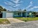 Charming single-story home with a well-maintained lawn, attached garage, and a clean, modern facade at 440 89Th Ave, St Pete Beach, FL 33706