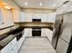 Beautifully renovated kitchen with stainless steel appliances, modern cabinetry, and stylish countertops at 440 89Th Ave, St Pete Beach, FL 33706