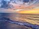 Beautiful sunset over the ocean with colorful clouds reflecting on the water at 440 89Th Ave, St Pete Beach, FL 33706