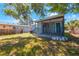 View of a charming single-story home with a quaint porch, surrounded by a lush green lawn at 513 88Th N Ave, St Petersburg, FL 33702