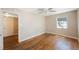 Bedroom featuring hardwood floors, neutral walls, window with blinds, and ceiling fan at 513 88Th N Ave, St Petersburg, FL 33702