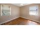 Bedroom with natural light and hardwood floors, neutral walls, ceiling fan, and windows at 513 88Th N Ave, St Petersburg, FL 33702