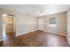 Bright living room with hardwood floors and multiple doorways for smooth transitions throughout the home at 513 88Th N Ave, St Petersburg, FL 33702