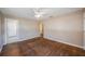 Bright living room with hardwood floors and natural light, complemented by neutral wall color at 513 88Th N Ave, St Petersburg, FL 33702