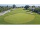 Scenic golf course view showcasing lush green fairways and manicured putting green on a sunny day at 5505 Puerta Del Sol S Blvd # 321, St Petersburg, FL 33715