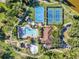 Aerial view of community amenities including pool, sports courts, playground, and clubhouse at 5704 Eaglemount Cir, Lithia, FL 33547