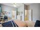 Spacious bedroom with a ceiling fan, desk, and a view to the en-suite bathroom at 5704 Eaglemount Cir, Lithia, FL 33547