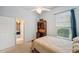 Comfortable bedroom featuring a ceiling fan, a built-in desk, and a window view at 5704 Eaglemount Cir, Lithia, FL 33547