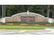 The Fish Hawk Ranch community sign featuring attractive landscaping and a stone facade at 5704 Eaglemount Cir, Lithia, FL 33547