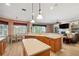 Open concept kitchen featuring an island, breakfast bar, and view into the adjacent dining and living area at 5704 Eaglemount Cir, Lithia, FL 33547