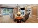 Open concept living room featuring a fireplace, built-in shelving, and a view of the lanai at 5704 Eaglemount Cir, Lithia, FL 33547