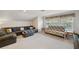 Upstairs living room featuring a comfortable couch, a futon and plush carpeting at 5704 Eaglemount Cir, Lithia, FL 33547