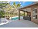 A beautiful screened-in pool area with lush landscaping and an open-air feel at 5704 Eaglemount Cir, Lithia, FL 33547