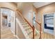 Elegant staircase leading to the upper level, showcasing the home's design at 5704 Eaglemount Cir, Lithia, FL 33547