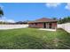 Expansive backyard featuring a well-maintained lawn and privacy fence at 5860 War Admiral Dr, Wesley Chapel, FL 33544