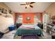 Comfortable bedroom showcasing a large bed, ample natural light, and decorative shelving at 5860 War Admiral Dr, Wesley Chapel, FL 33544