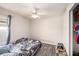 Neat bedroom with ceiling fan, natural light, and closet at 5860 War Admiral Dr, Wesley Chapel, FL 33544