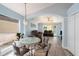 Open-concept living and dining areas with modern flooring at 5860 War Admiral Dr, Wesley Chapel, FL 33544