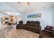 Open floor plan showcasing the kitchen and living areas with lots of natural light at 5860 War Admiral Dr, Wesley Chapel, FL 33544