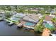 Waterfront property featuring a private pool, screened lanai, and dock with boat lift at 6119 Galleon Way, Tampa, FL 33615