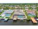 Aerial view of the property featuring a private pool, boat dock, and waterfront access at 6119 Galleon Way, Tampa, FL 33615