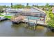 Overhead view showcasing a private pool, boat dock, and convenient lift for watercraft at 6119 Galleon Way, Tampa, FL 33615