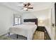 Bright bedroom features a large bed with an adjacent nightstand and dresser at 6119 Galleon Way, Tampa, FL 33615
