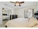 Bright bedroom features a large bed with an adjacent sliding mirror door and stone wall at 6119 Galleon Way, Tampa, FL 33615