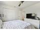 Well-lit bedroom with ample closet space and a television, creating a relaxing atmosphere at 6119 Galleon Way, Tampa, FL 33615