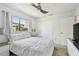 Bright bedroom with a large window, neutral tones, and a comfortable bed, creating a peaceful retreat at 6119 Galleon Way, Tampa, FL 33615