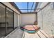 Screened in courtyard with a hot tub, patio and sliding doors to the interior at 6119 Galleon Way, Tampa, FL 33615