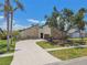 Attractive single-Gathering home boasting well-maintained landscaping and a circular driveway at 6119 Galleon Way, Tampa, FL 33615
