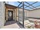 Stone accents highlight the front entrance featuring a covered porch and private courtyard with a hot tub at 6119 Galleon Way, Tampa, FL 33615