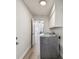 Functional laundry area with appliances, storage, and durable wood-look flooring at 6119 Galleon Way, Tampa, FL 33615