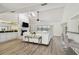 Bright living room with vaulted ceilings, fireplace, and scenic waterfront views through sliding glass doors at 6119 Galleon Way, Tampa, FL 33615