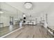 Bright living room featuring wood floors, a fireplace, and lots of space for Gathering and friends to gather at 6119 Galleon Way, Tampa, FL 33615