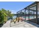 Enjoy scenic views from the screened-in lanai & pool, with lush garden landscaping at 6119 Galleon Way, Tampa, FL 33615