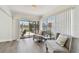 Inviting sun room with serene outdoor views, providing the perfect spot for relaxation at 6119 Galleon Way, Tampa, FL 33615