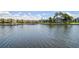 Picturesque water view with waterfront townhomes, docks and lush greenery surrounding the waterway at 6119 Galleon Way, Tampa, FL 33615