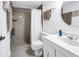 Bathroom with a white toilet, vanity, mirror and shower with curtain at 6265 Sun Blvd # 605, St Petersburg, FL 33715