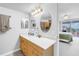 Bright bathroom with double sinks and seamless access to the main bedroom at 6265 Sun Blvd # 605, St Petersburg, FL 33715