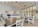 The dining area features multiple tables and chairs, a kitchenette, and views of the outdoor area at 6265 Sun Blvd # 605, St Petersburg, FL 33715