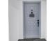 Condo front door with number 605, featuring decorative welcome sign, hardware, and tiled design at 6265 Sun Blvd # 605, St Petersburg, FL 33715