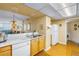 Kitchen with updated cabinets and open design, seamlessly connected to the living area with plenty of light at 6265 Sun Blvd # 605, St Petersburg, FL 33715