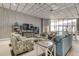 Inviting living room features stylish decor, bookshelves, and a large window with plenty of natural light at 6265 Sun Blvd # 605, St Petersburg, FL 33715