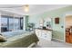 Relaxing main bedroom with waterfront balcony, TV and elegant decor at 6265 Sun Blvd # 605, St Petersburg, FL 33715