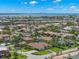 Beautiful aerial view of neighborhood homes and a bridge in the distance at 703 Monte Cristo Blvd, Tierra Verde, FL 33715