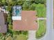 Expansive waterfront home with lush landscaping, screened pool, and circular drive at 703 Monte Cristo Blvd, Tierra Verde, FL 33715