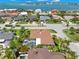 Coastal community home, showcasing the lush lawns at 703 Monte Cristo Blvd, Tierra Verde, FL 33715